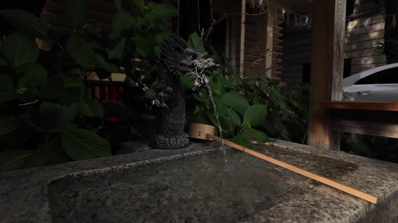 Shinto shrine ceremonial purification fountain Temizuya Buddhist temples in Japan