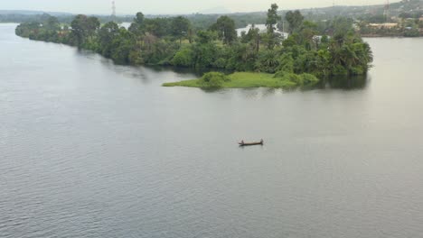 island on the volta river in ghana with canoe or boat