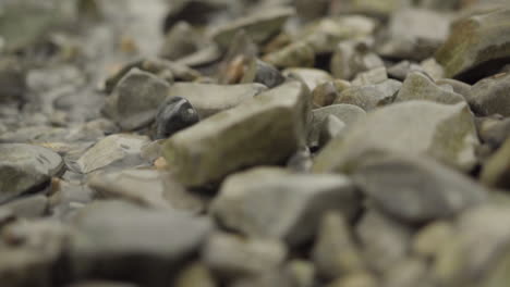 Tide-washing-over-pebbles-on-an-Italian-lake-shore-in-slow-motion