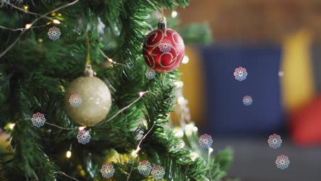 Animation-of-snow-falling-over-christmas-tree-with-baubles