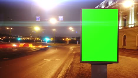 a billboard with a green screen on a streetы.time lapse.