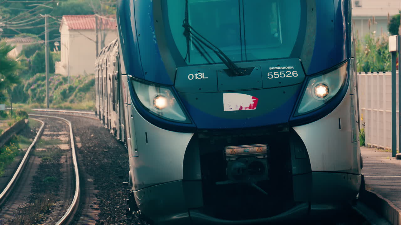 Close up of a blue train moving on the rails in France