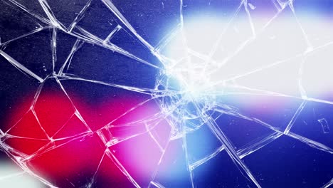police lights flash behind wet, shattered glass or windshield. crime scene, accident, or violence concept with rain and red and blue lights
