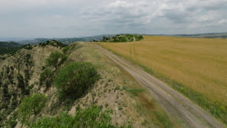 cinematic cliffside road at echo view point, vashlovani nature reserve, republic of georgia, aerial