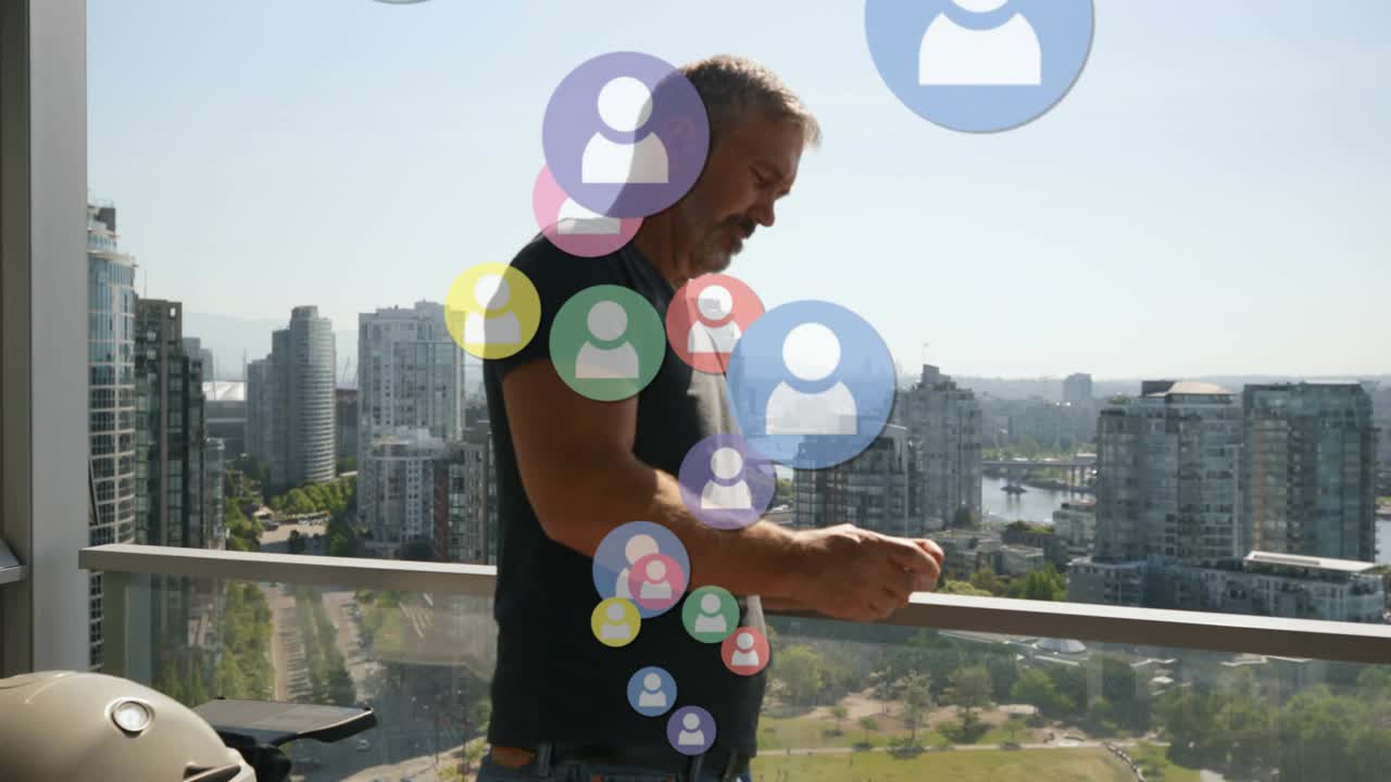 Man on balcony scrolling smartphone spawning avatar icons floating around torso for technology demo