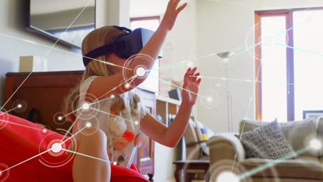 animation of network of connections with icons over girl wearing vr headset