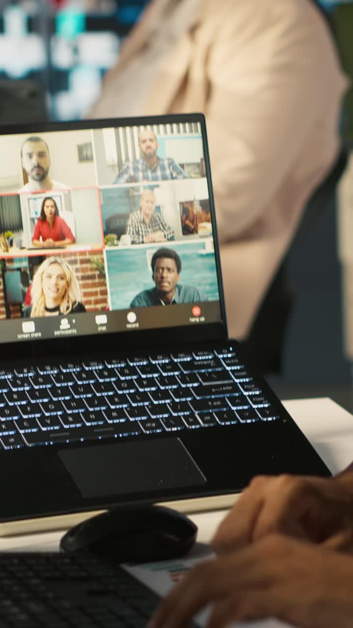 Vertical video Employee having online discussion with coworkers in video call meeting