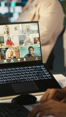 vertical video employee having online discussion with coworkers in video call meeting
