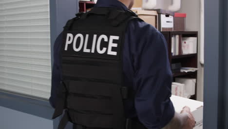 police officer walking through an office