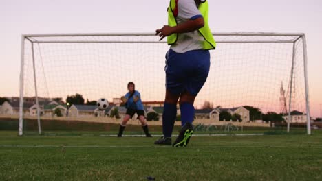 Female-keeper-waiting-for-female-soccer-player-to-shoot-the-ball.-4k