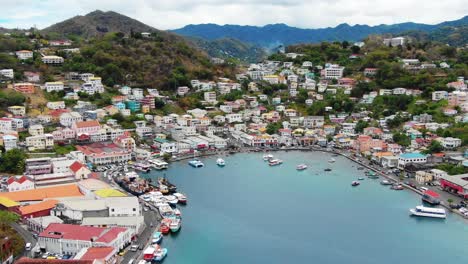 panoramic aerial establishing of turquoise blue water in port cove inlet of colorful carenage grenada