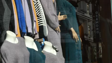 women's knitwear display in a store window