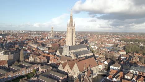 Aerial-Church-of-Our-Lady,-Bruges-on-a-nice-sunny-day,-Drone-Shot-4k