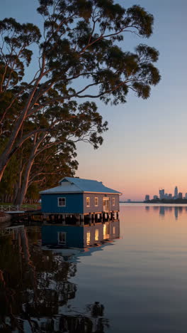 blue boathouse on swan river at dawn or dusk