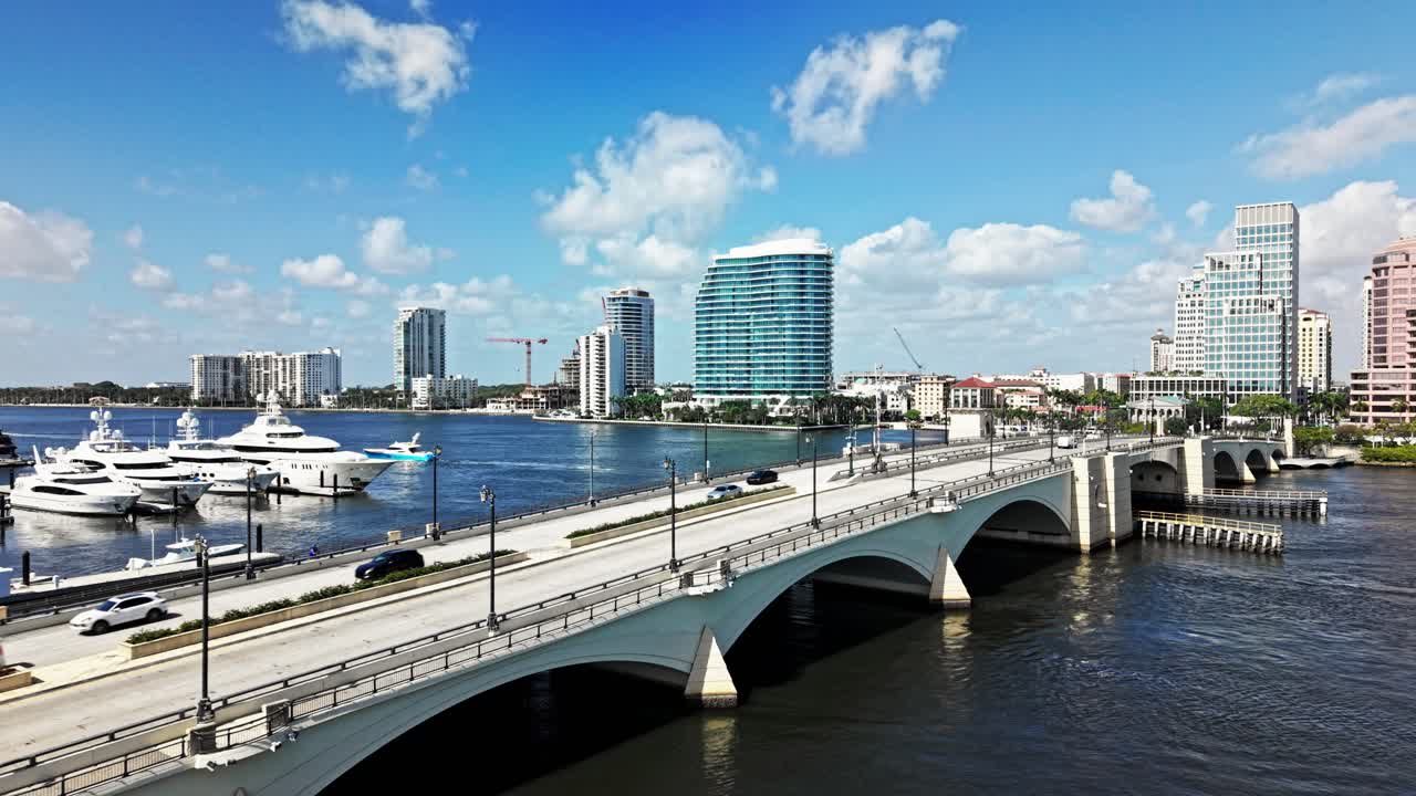 Pull out drone shot of Royal Park Bridge with One Flagler and Phillips Point building in West Palm Beach, Florida, USA
