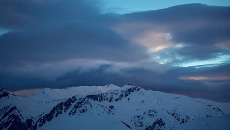 beautiful winter images of cloud formations above the snowy mountain tops