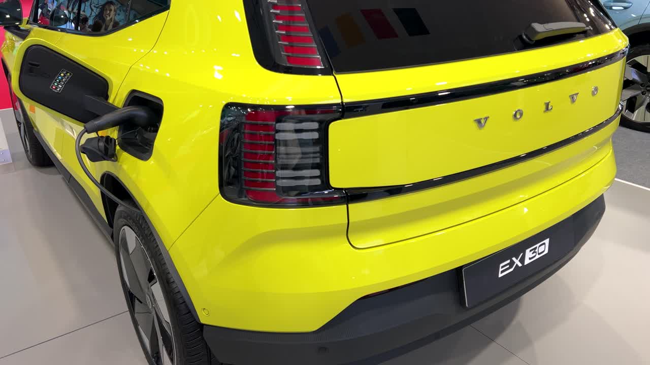 Rear view of a yellow Volvo EX30 charging. Fully electric EX30. Sofia Motor Show 2024.