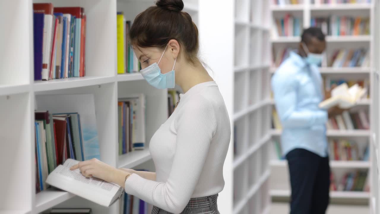 Students Reading in a Library During a Pandemic