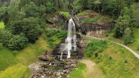 Steinsdalsfossen-is-a-waterfall-in-the-village-of-Steine-in-the-municipality-of-Kvam-in-Hordaland-county,-Norway.-The-waterfall-is-one-of-the-most-visited-tourist-sites-in-Norway.