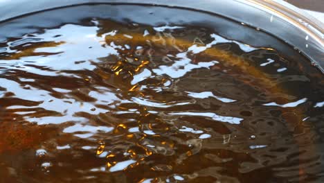 close up of water boiling in a pot