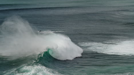 Wide-shot-of-surfers-and-jetskis-on-the-waves