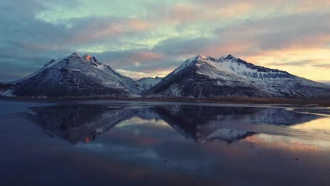 snowy mountains against sundown sky