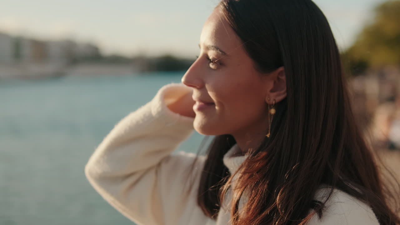 Woman Enjoying Sunset By The River In Seville