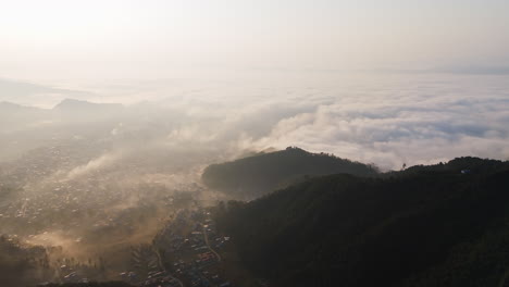 Aerial overview of the Pokhara city and the Phewa lake, misty sunrise in Nepal