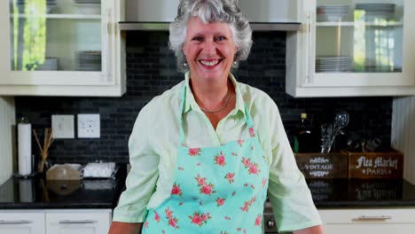 Senior-woman-standing-in-kitchen-4k