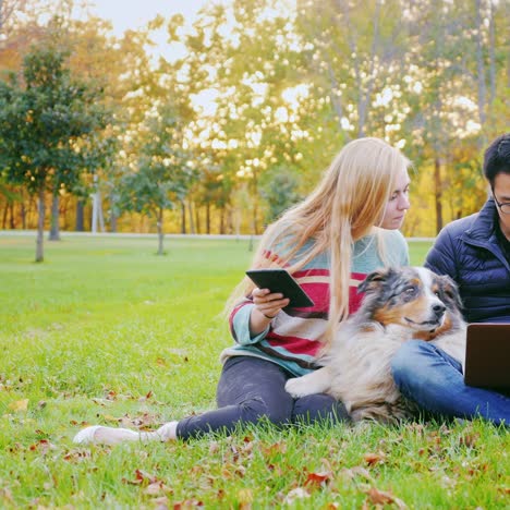 Friends-Relaxing-On-The-Lawn-In-The-Park-1