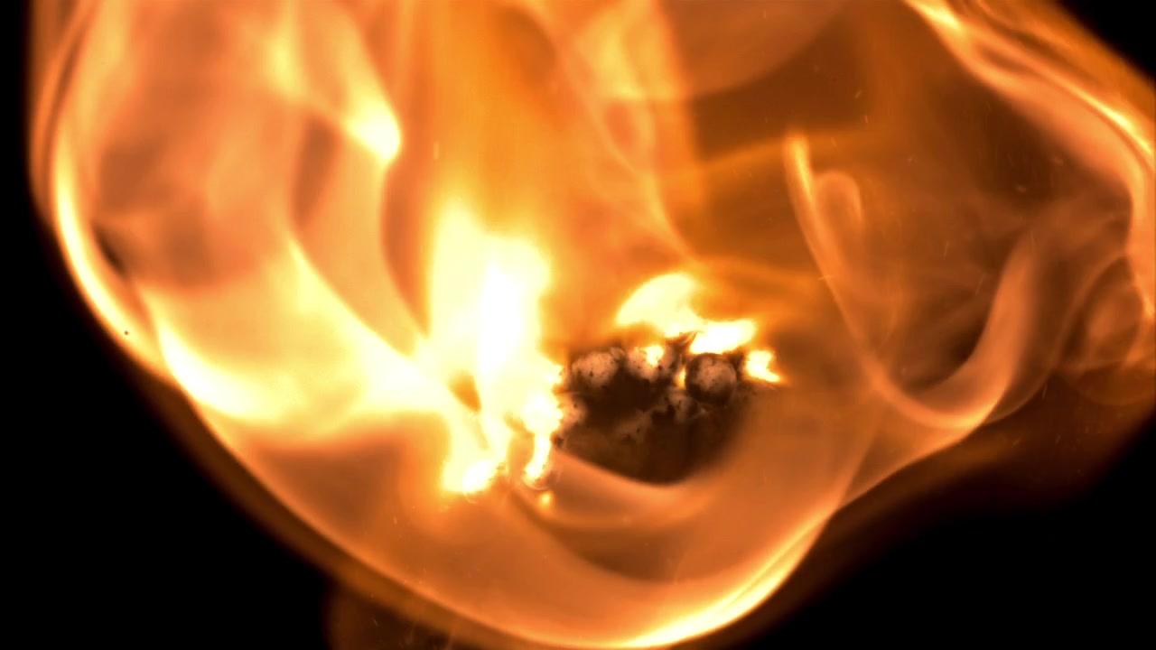 Dynamic Orange and Yellow Flames Igniting and Spreading on Black Background