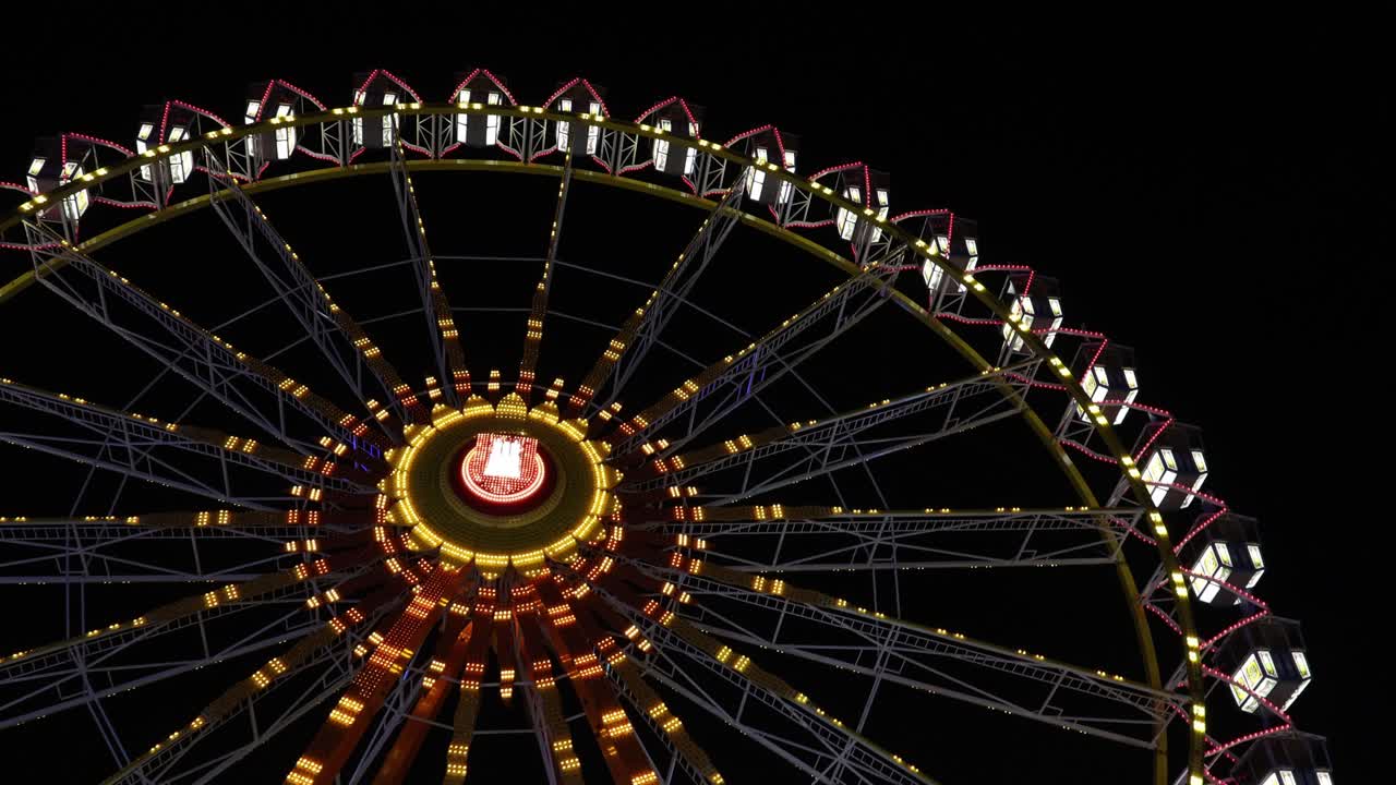 Ferris wheel on a dark background, establisher