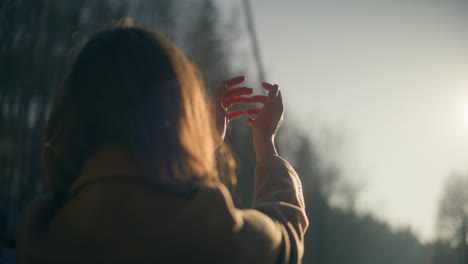 inspired woman hands in sun