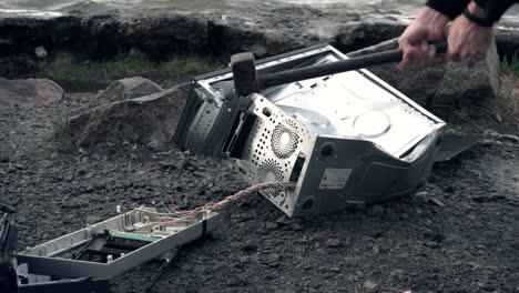 broken computer parts on the riverbank