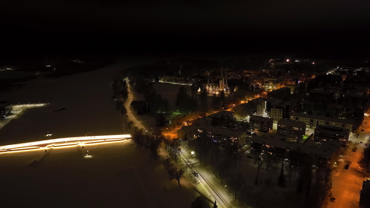 Aerial view along the river, toward the church of Joensuu, winter in Finland