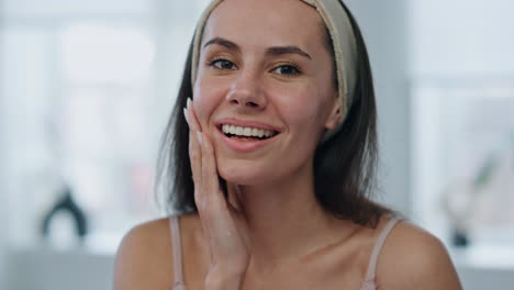 Happy-woman-touching-skin-smiling-at-bathroom-portrait.-Cheerful-lady-posing