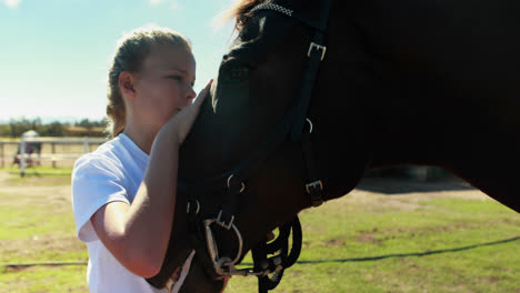 Girl-caressing-the-horse-in-the-ranch-4k