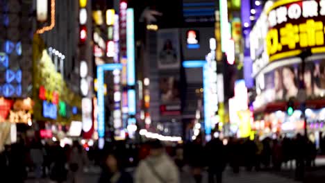 crowded urban street with vibrant night lights