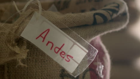close up of andes coffee beans in burlap sack