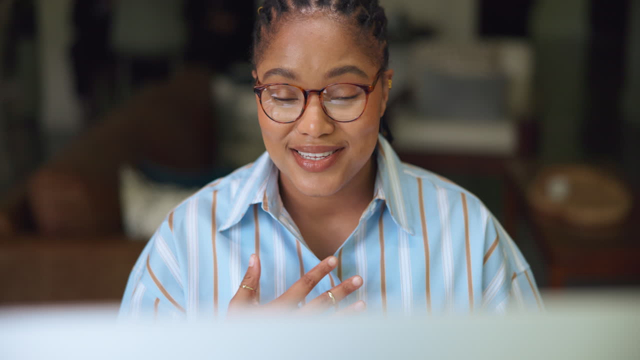 Happy Young Woman Talking and Gesturing on a Video Call