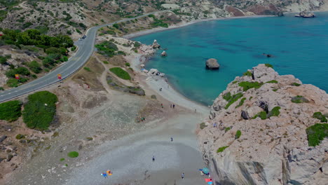 aerial drone reveal shot of aprhodites beach with turquoise crystalline water