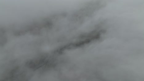 dense fog obscures the landscape over hafursey, iceland, creating a mysterious and atmospheric scene.