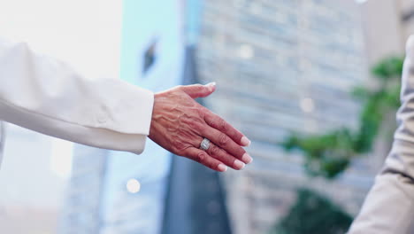 business handshake in the city