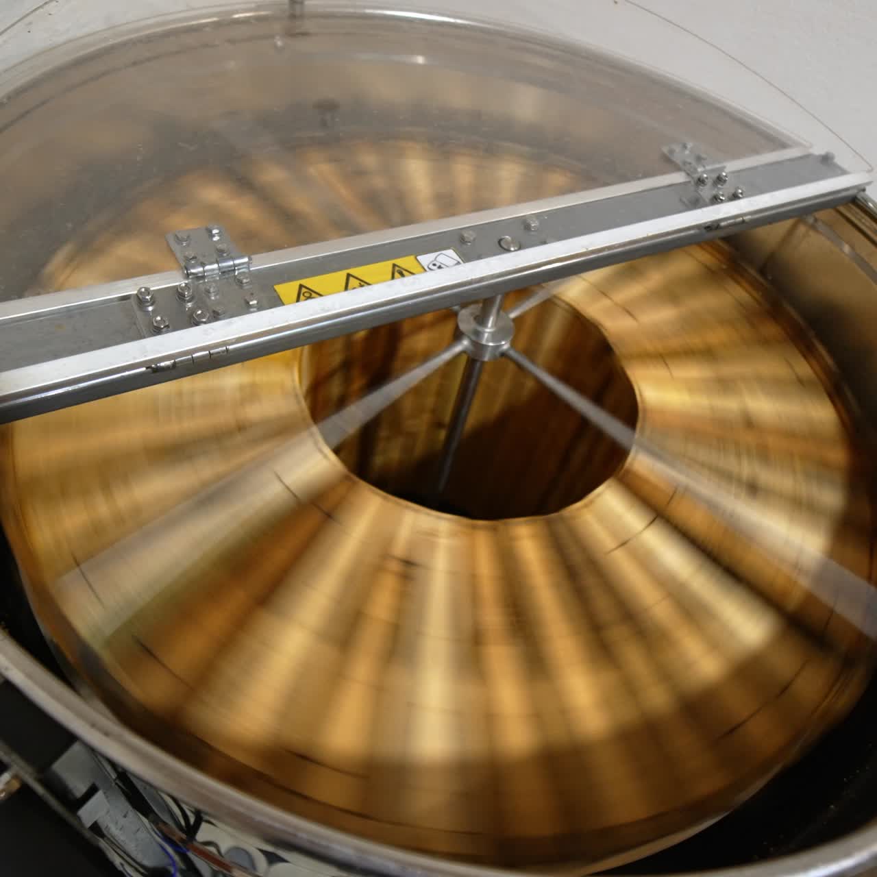 Honey extraction in the electric machine working in the apiary. Apparatus rotating frames to gather honey harvest. Top view