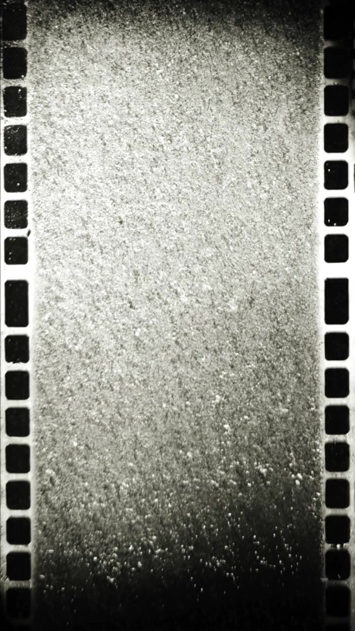 Texture astratta di grana di pellicola vintage con perforazioni
