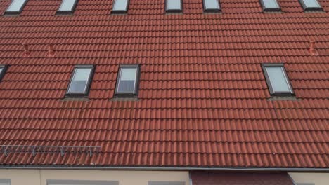 a drone flies over the roof of a house