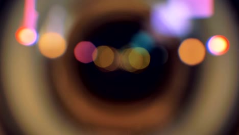 a macro view on a camera lens going out of focus.