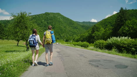 young couple hitchhiking 4k video