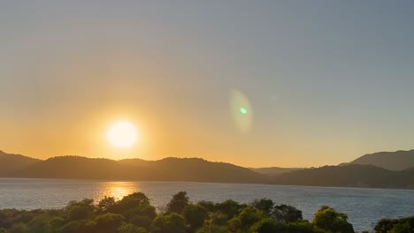 amazing sunset with sunlight way on water over seascape