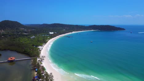 long set beach in koh rong island, featuring turquoise waters, white sand beache and lush tropical vegetation. perfect aerial view flight drone shot footage from above